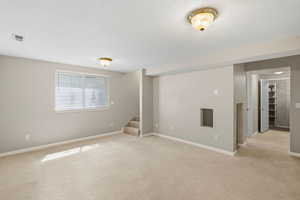 Basement family room view toward the stairs.