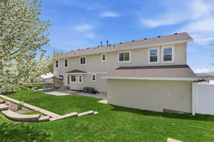 View from garden area toward terraced planters and patio.