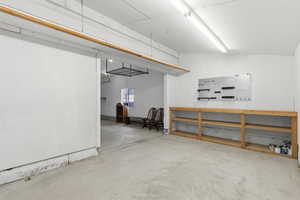 Large workshop located at the back of the 3rd car garage with double door toward back yard.