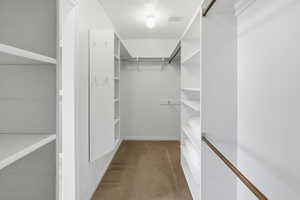 Primary suite walk-in closet.