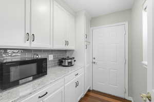 View of butlers pantry from kitchen heading toward the garage.