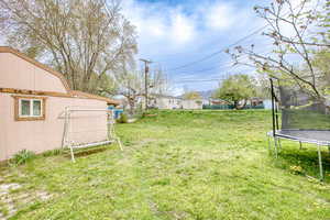 View of yard featuring a trampoline
