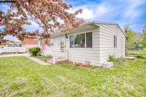 View of front of house with a front yard