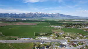 Aerial view of sparsely populated area featuring a mountain backdrop