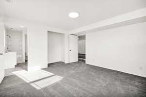 Unfurnished bedroom featuring carpet floors and a closet