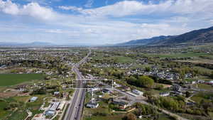 Aerial perspective of suburban area with a mountainous background