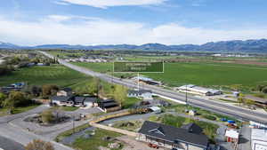Aerial view of sparsely populated area featuring mountains and nearby suburban area