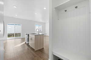 Mudroom featuring dark wood-style flooring and recessed lighting