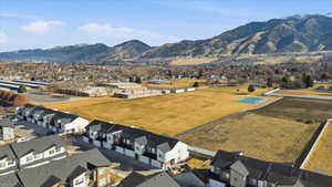 Aerial perspective of suburban area featuring a mountain backdrop