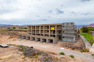 View of property with a mountain view