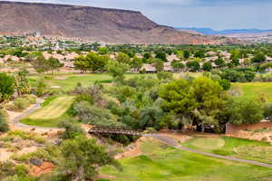 Mountain view featuring a golf club and nearby suburban area