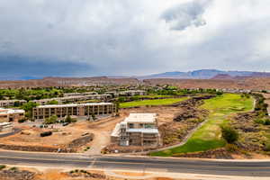 Aerial view of a mountainous background and a golf course