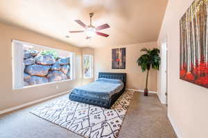 Bedroom with carpet floors and a ceiling fan