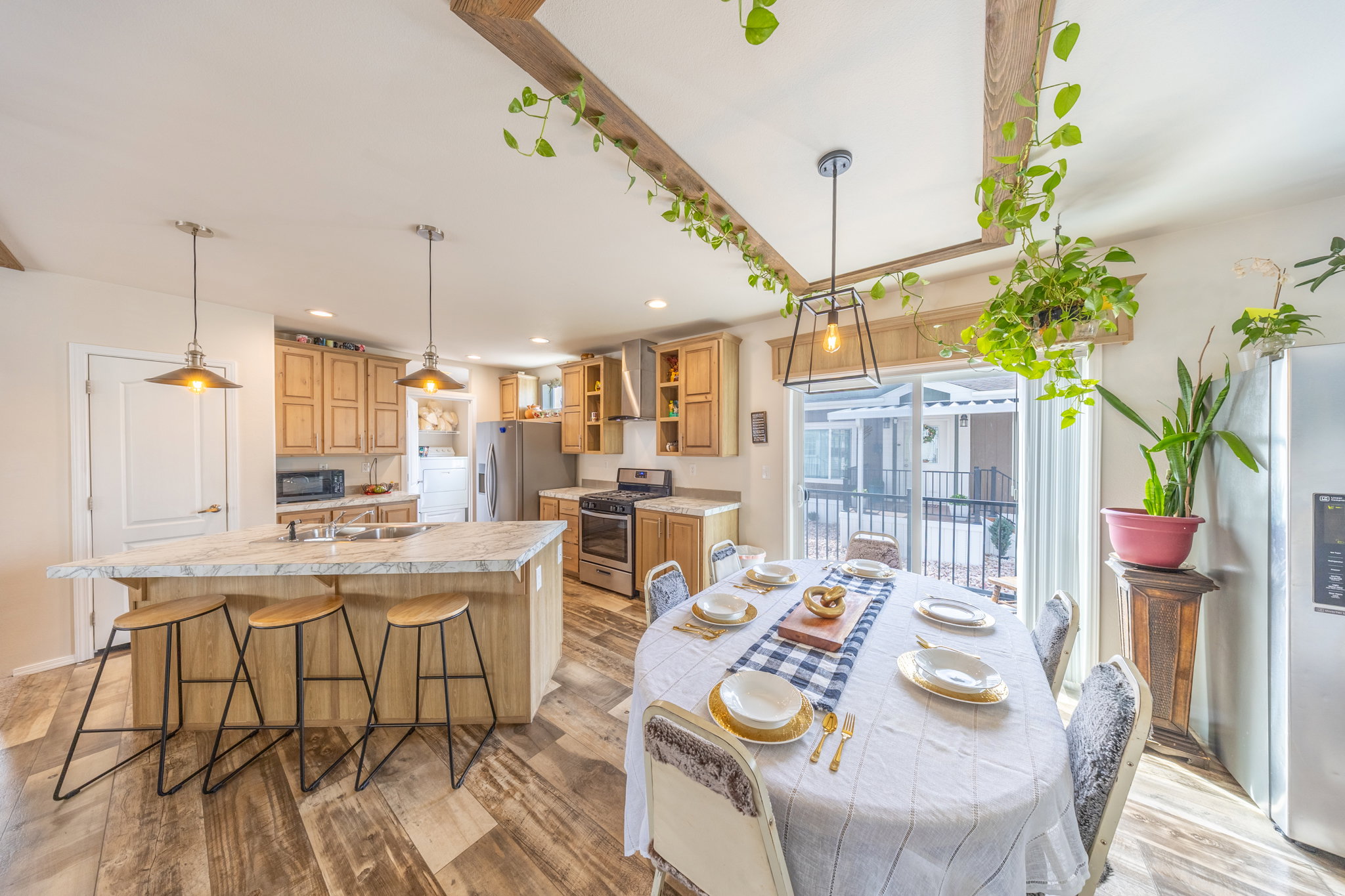 Dining area featuring light wood finished floors, recessed lighting.