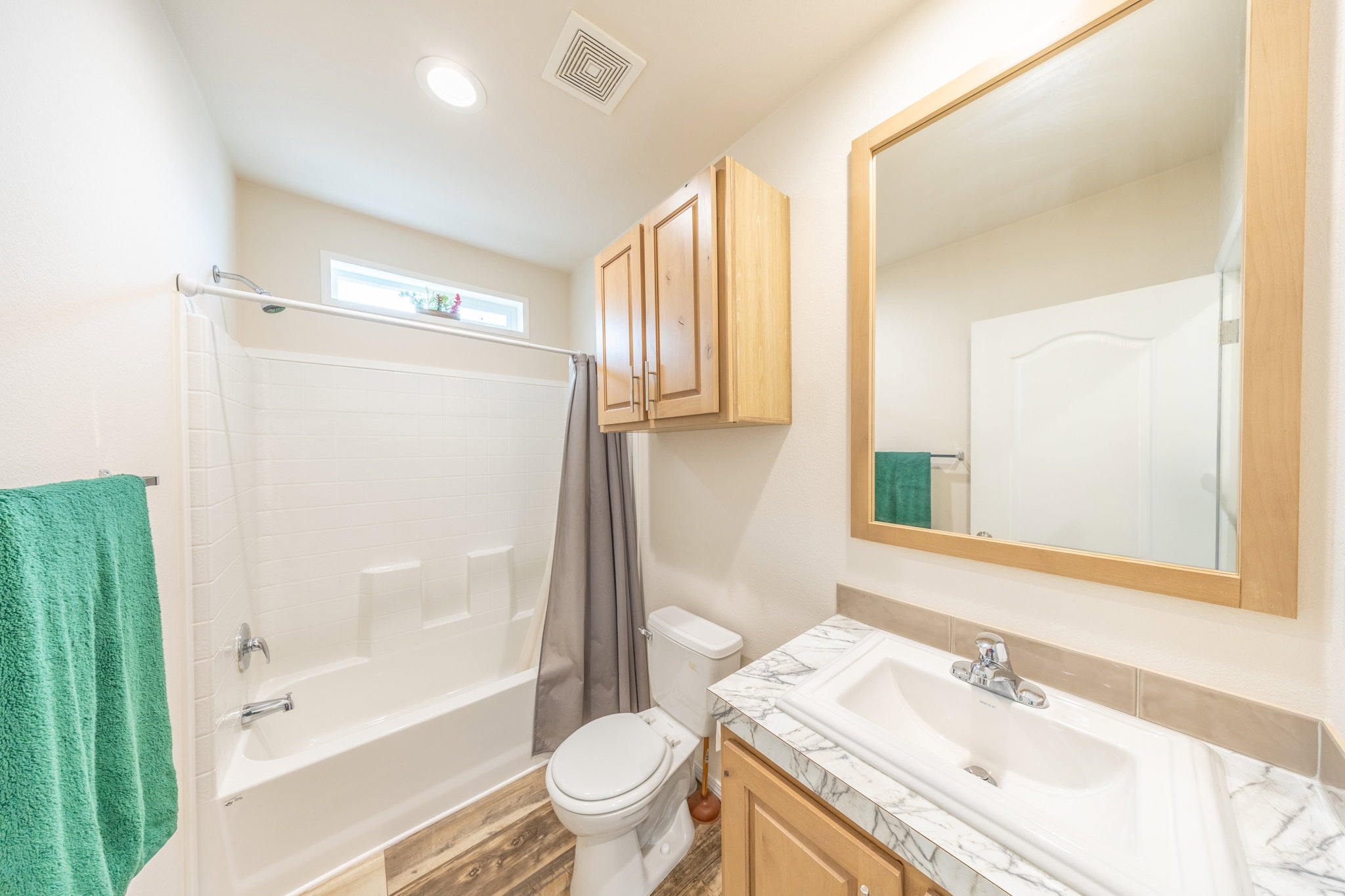 Full bathroom featuring vanity and shower / bath combo