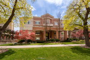 View of front of home featuring a front lawn and stucco siding