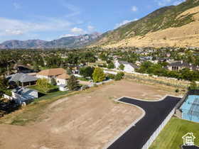 Aerial perspective of suburban area with a mountain backdrop