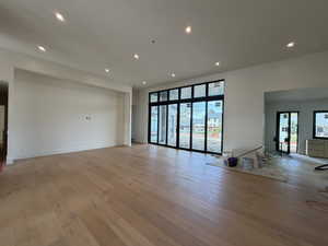 Unfurnished living room featuring recessed lighting and light wood-style floors