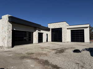 Garage featuring driveway