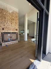 Unfurnished living room with wood finished floors and recessed lighting