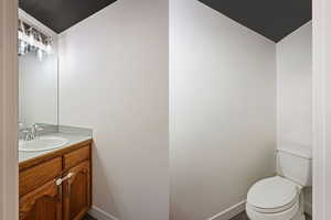 Bathroom featuring vanity and baseboards