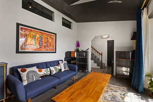 Living area featuring stairway and wood finished floors