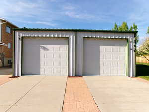 View of detached 32x30 garage with 10x12 doors.