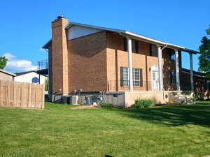 View of northwest side of property featuring a covered porch