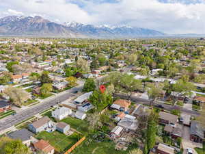 Aerial perspective of suburban area featuring a mountainous background