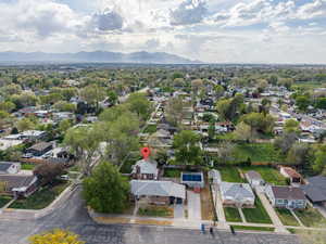 Aerial perspective of suburban area featuring a mountain backdrop