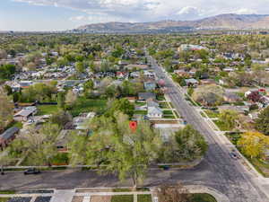Aerial view of residential area featuring a mountainous background