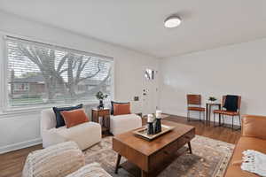 Living area featuring wood finished floors and baseboards