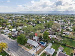 Aerial perspective of suburban area with a mountain backdrop