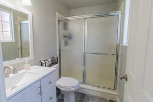 Full bathroom featuring vanity and a stall shower