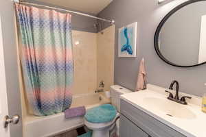 Bathroom with vanity and shower / bath combo