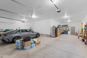 Garage with built-in shelving and garage door openers