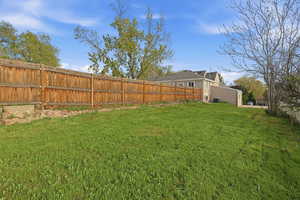 View of fenced backyard