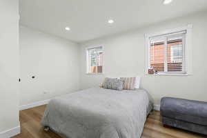 Bedroom featuring light wood-style floors and recessed lighting