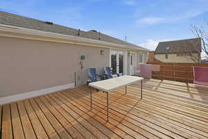 Wooden terrace featuring french doors