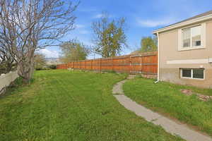View of fenced backyard