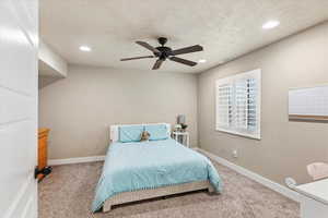 Bedroom with recessed lighting, carpet, ceiling fan, and a textured ceiling