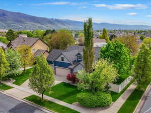 Aerial perspective of suburban area featuring a mountain backdrop