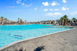 Community pool featuring a residential view