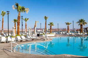 Community pool with a patio