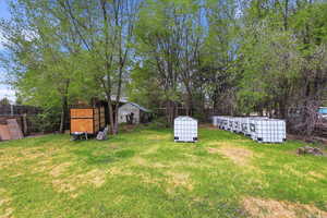 View of yard featuring a storage unit