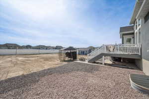 View of yard with a residential view, an outdoor fire pit, a patio area, and a deck