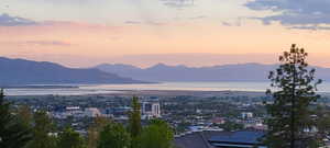 View of mountain backdrop featuring nearby urban area