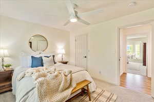 Bedroom featuring light colored carpet and ceiling fan