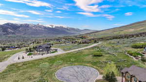Aerial perspective of suburban area featuring a mountain backdrop