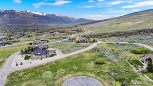 Aerial view of residential area featuring a mountain backdrop